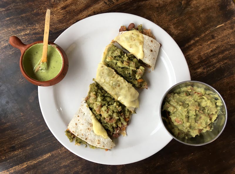 Smothered Burrito with green sauce and cheese